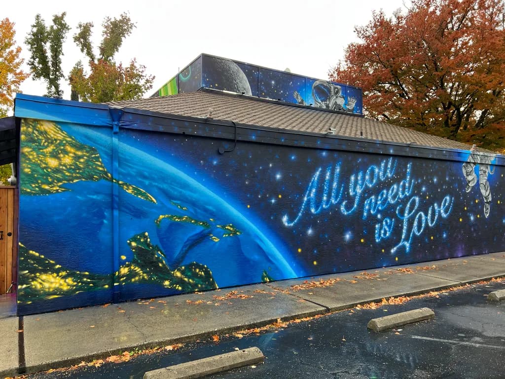 Cosmic Love: A Colorful Mural Celebrating Earth and Space Connections