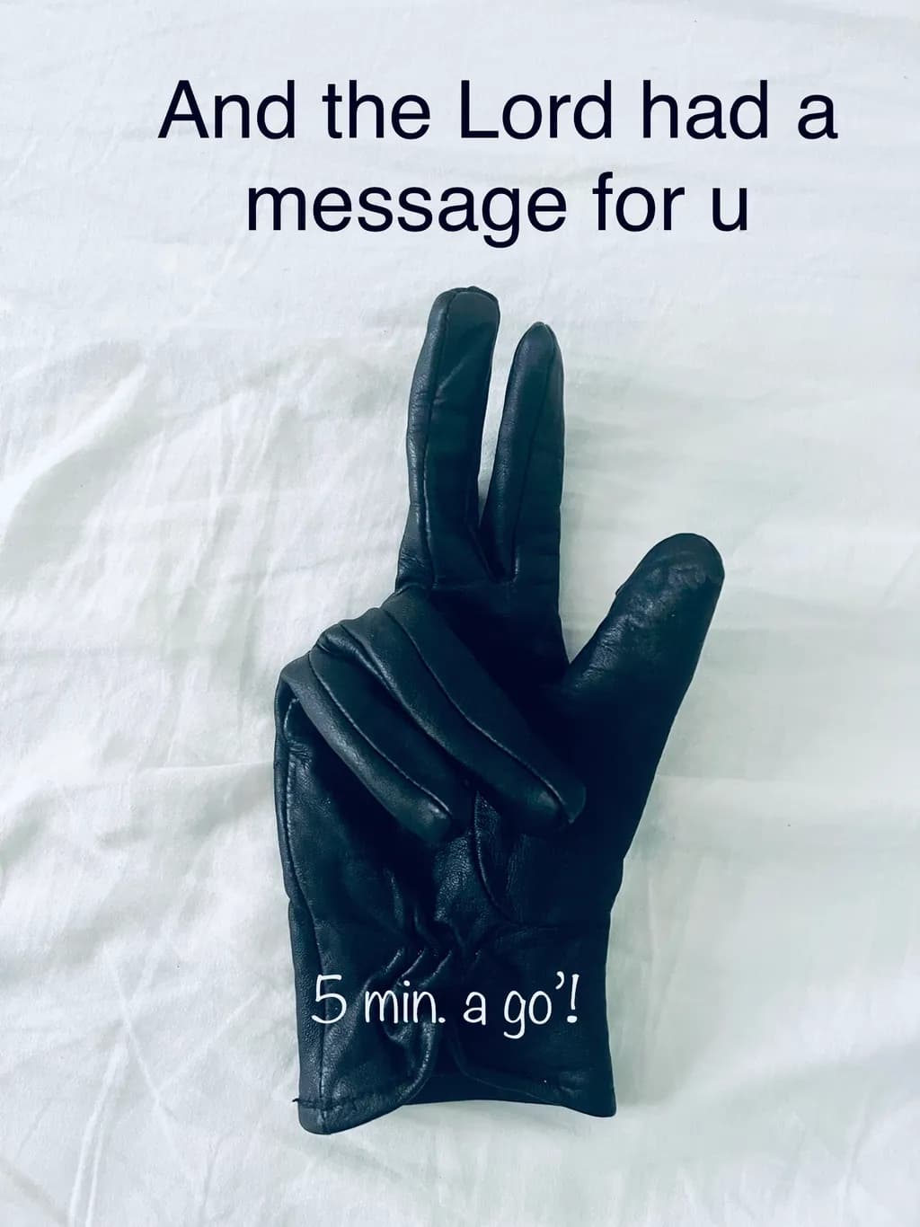 Divine Gesture: A Black Glove's Message of Time and Reflection