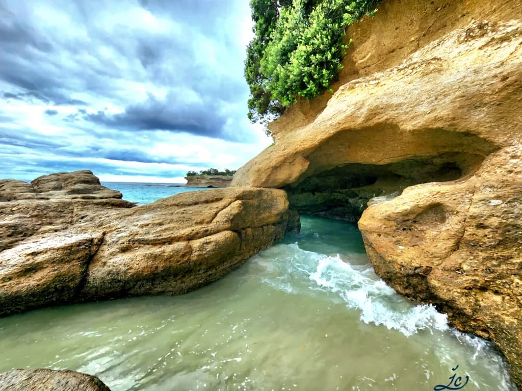 Whispers of the Shore: A Serene Coastal Escape Through Nature's Archway