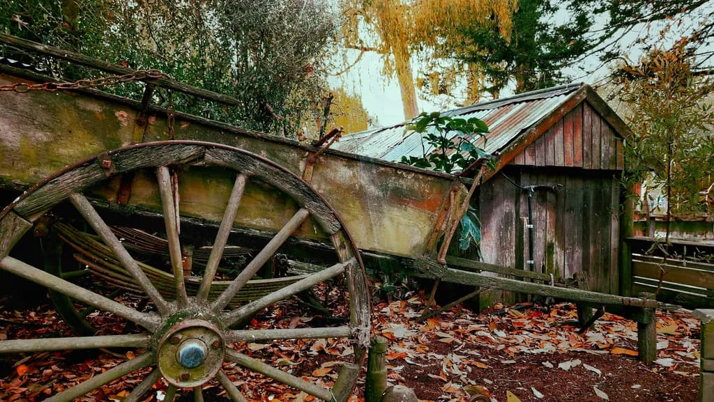 Whispers of Autumn: The Abandoned Cart in a Rustic Landscape