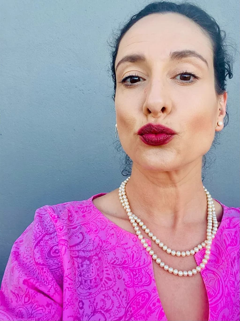 Radiant Elegance: A Portrait of Confidence in Pink and Pearls