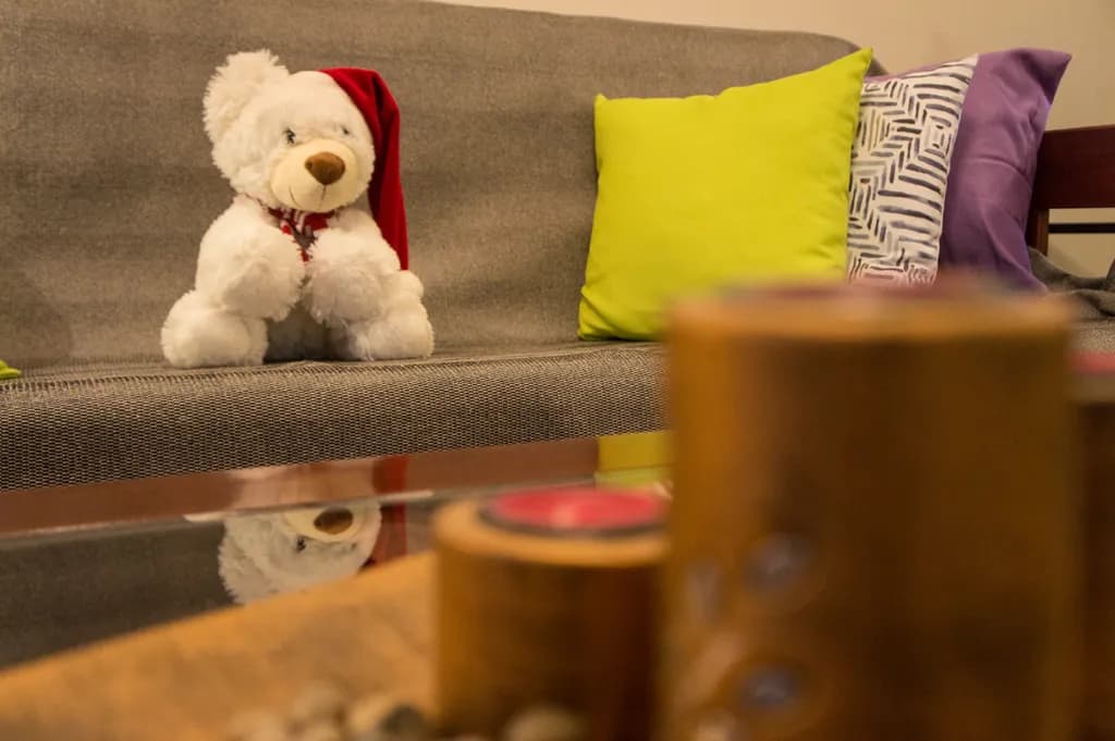Cozy Festive Vibes: A Plush Teddy Bear's Colorful Retreat