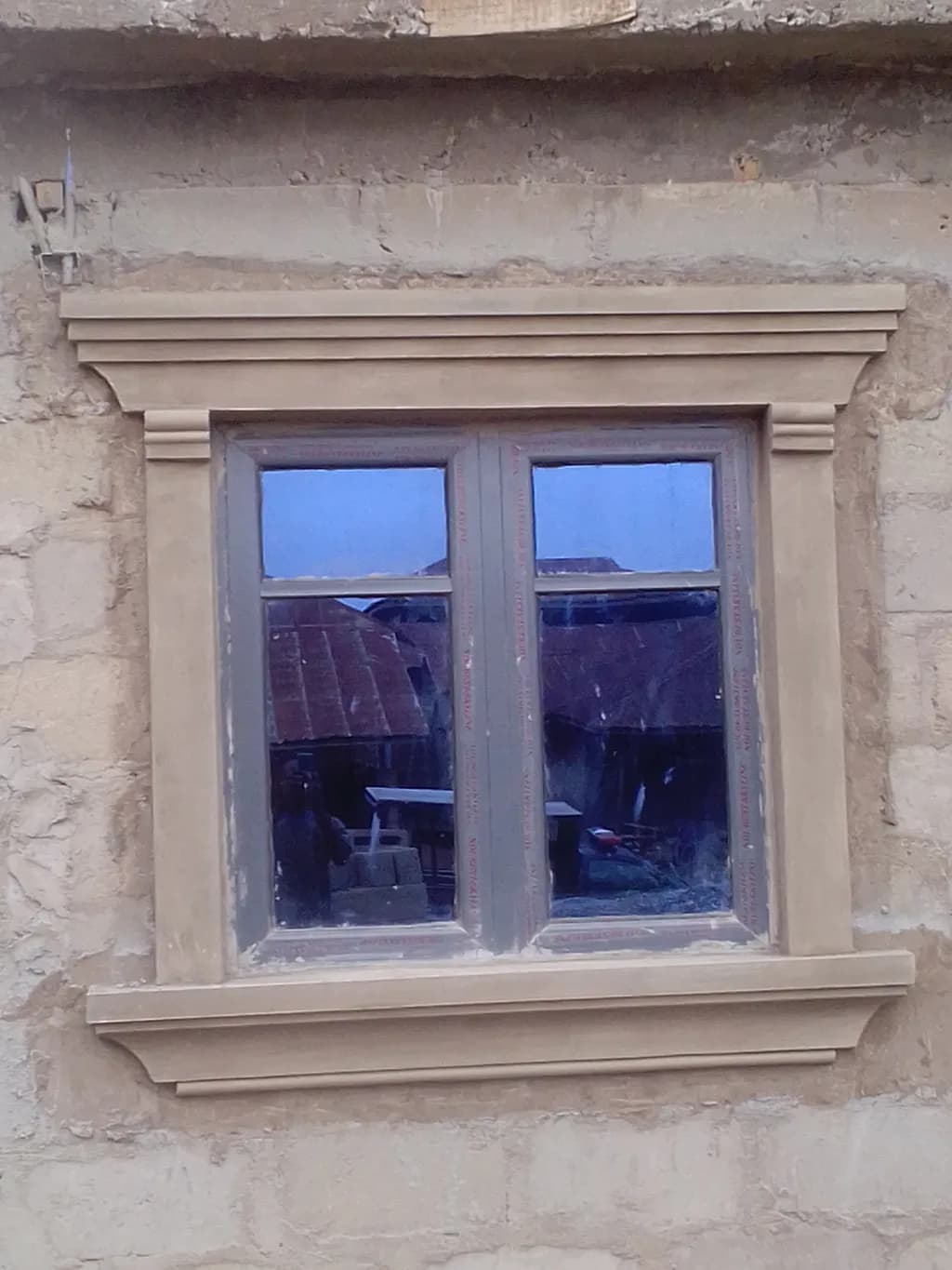 Reflections of Time: A Rustic Window Framed in History