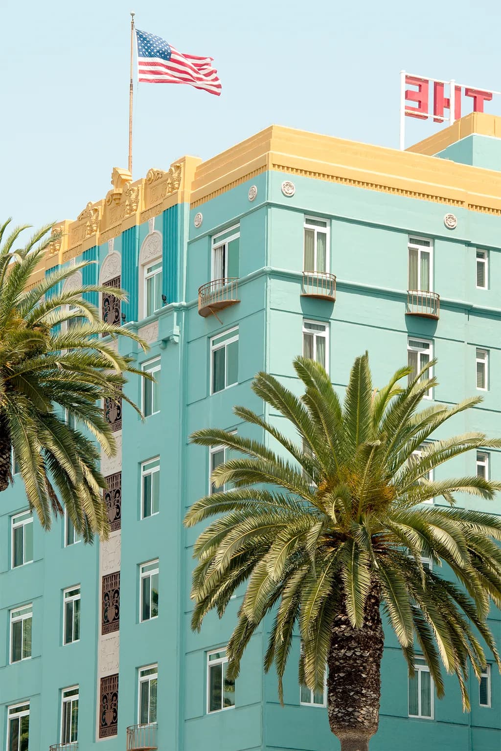 Vibrant Urban Oasis: A Colorful Architectural Tribute to Palm-Lined Streets and American Spirit