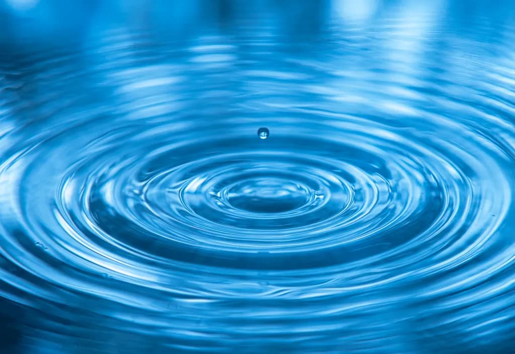 Rippling Serenity: A Dance of Blue Water and Reflection
