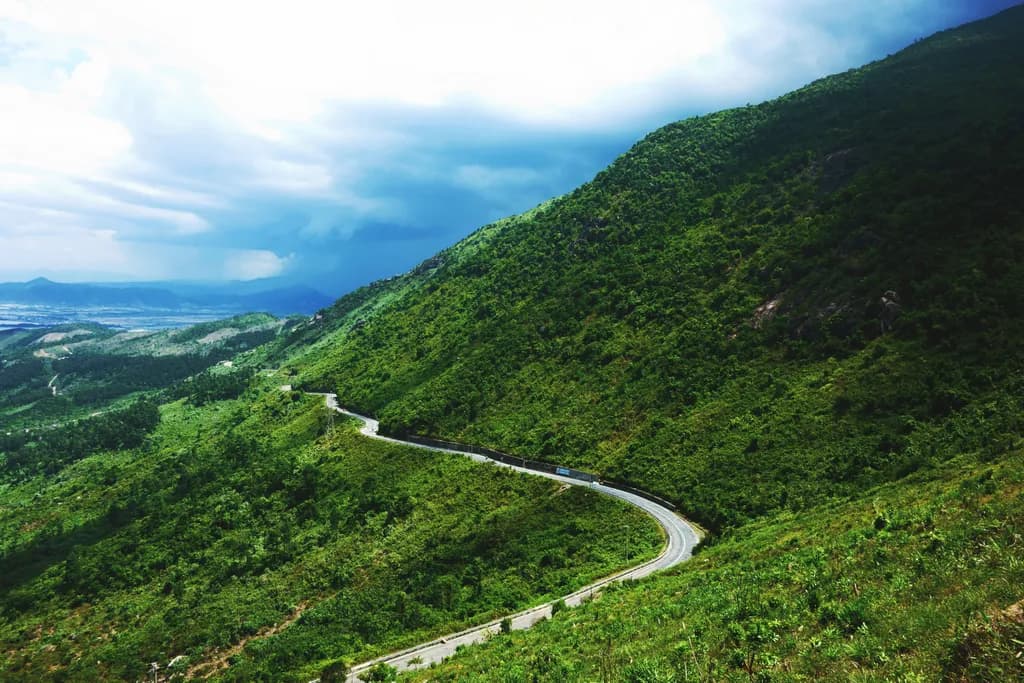 Whispers of the Winding Road: A Journey Through Lush Green Hillsides