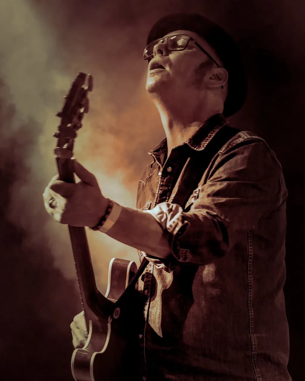Ethereal Strings: A Guitarist's Passionate Performance on Stage