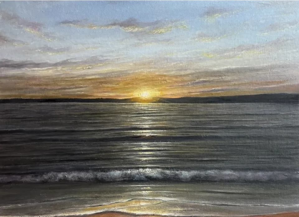 Serenity at Dusk: A Tranquil Sunset Over the Ocean Waves