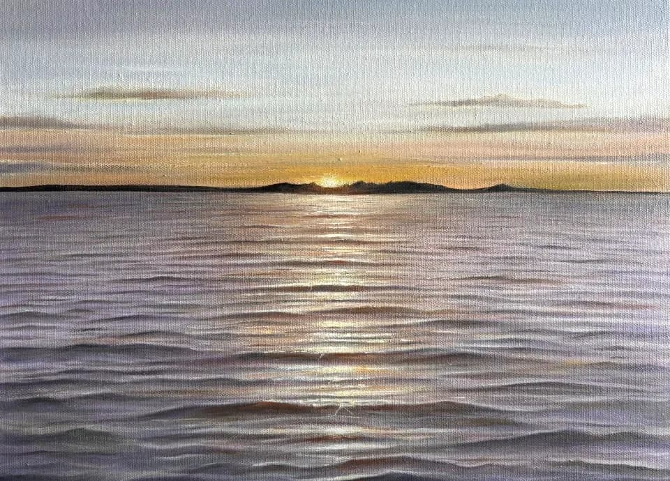 Serenity at Dusk: A Tranquil Sunset Over Gentle Waves
