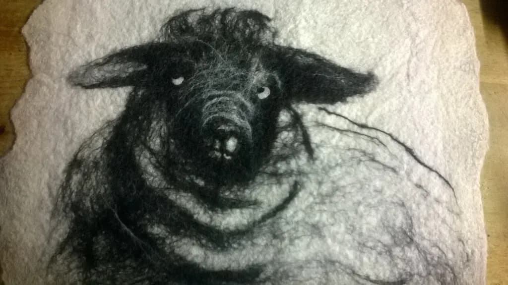 Whimsical Wool: A Playful Portrait of a Sheep in Felted Artistry