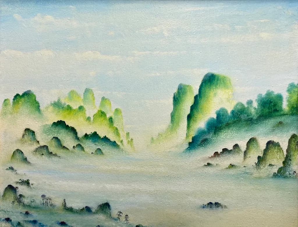 Whispers of Mist: A Serene Landscape of Ethereal Peaks and Tranquil Skies