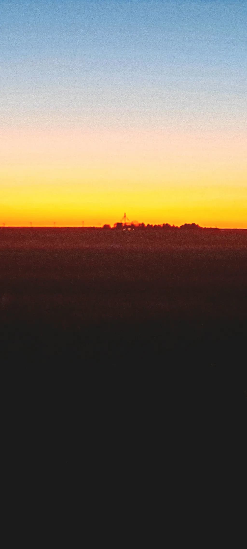Ethereal Horizon: A Serene Sunset Over Endless Fields