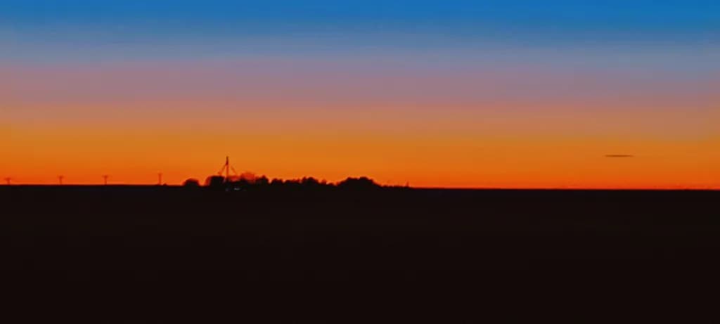 Whispers of Dusk: A Tranquil Sunset Over the Horizon