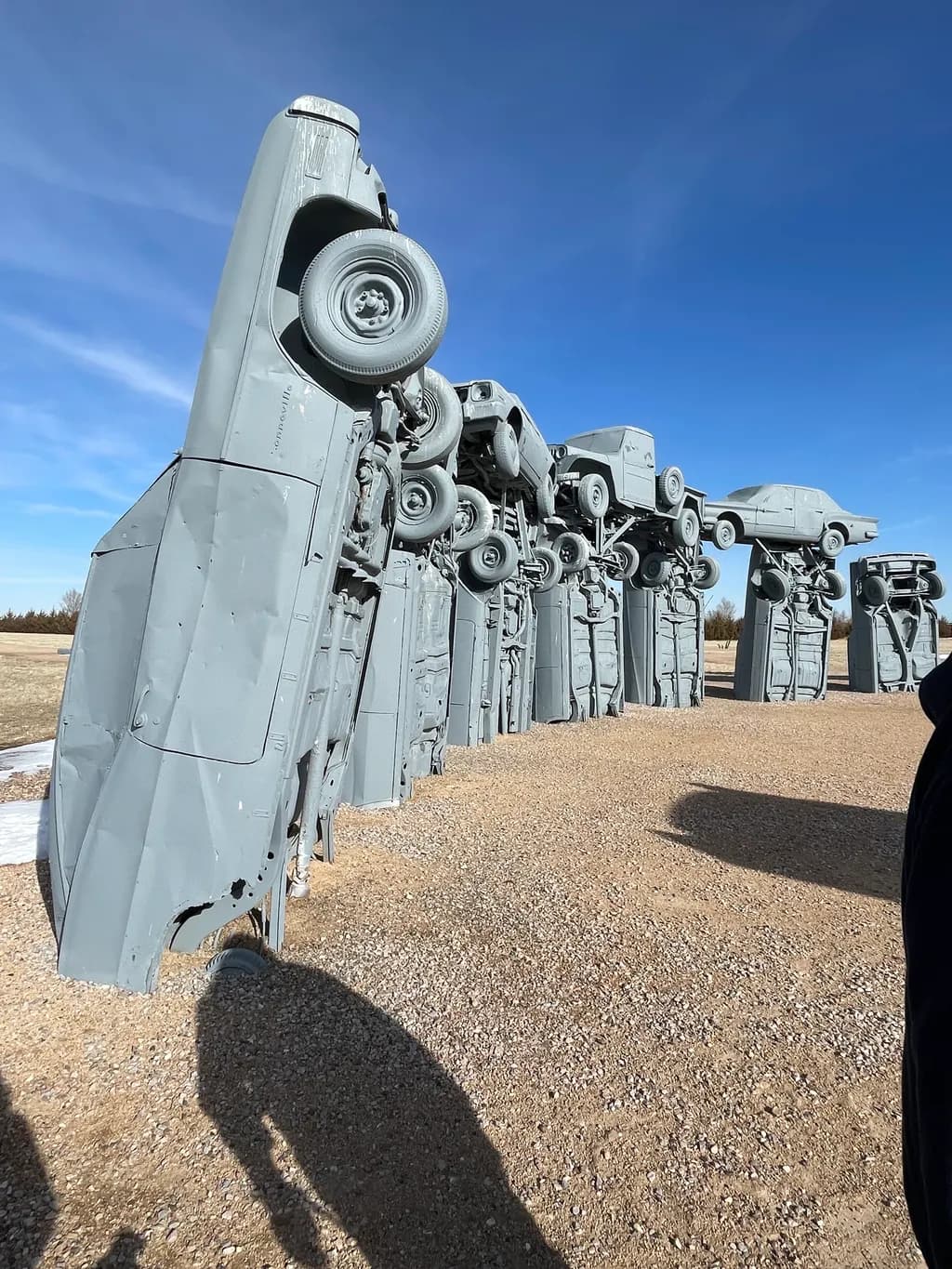 Urban Reverie: The Surreal Symphony of Upside-Down Cars in a Desert Landscape