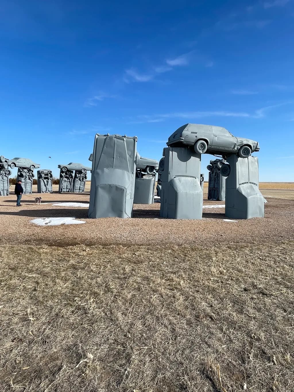 Urban Monoliths: A Surreal Landscape of Abandoned Automobiles and Skyward Dreams