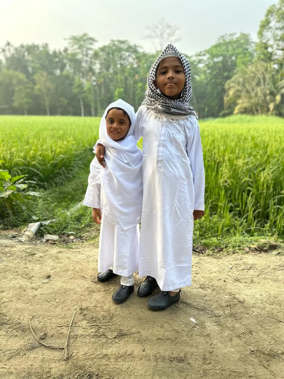 Whispers of Innocence: Two Sisters in Harmony Amidst Nature's Embrace