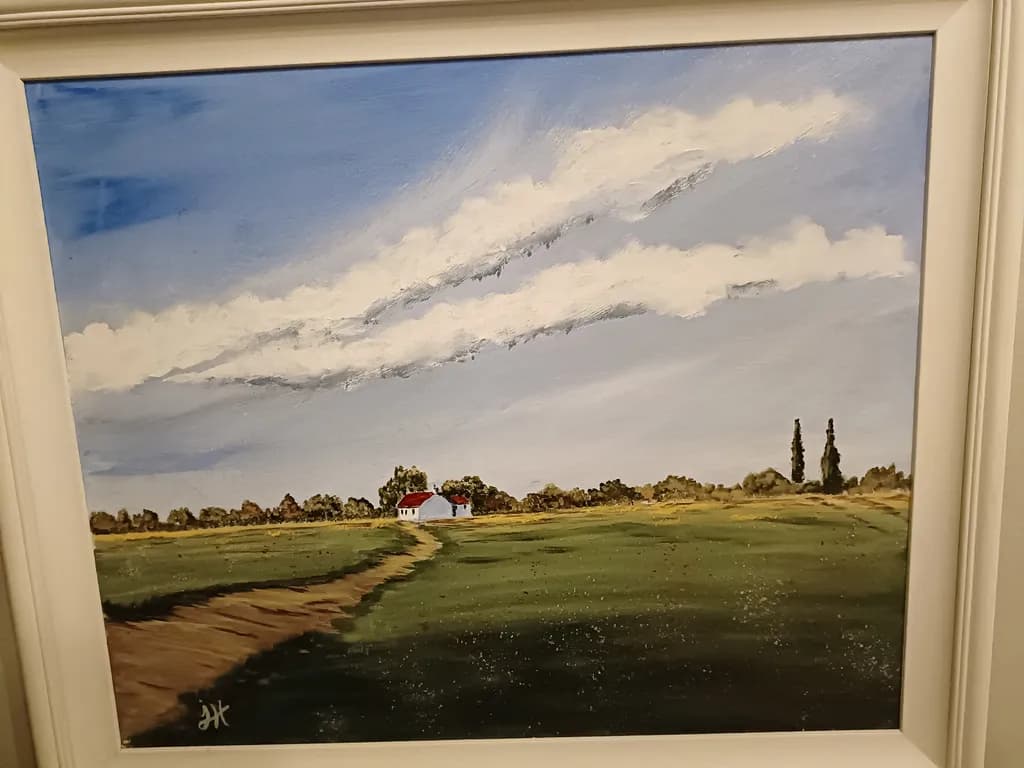Whispers of Serenity: A Tranquil Landscape with Rolling Clouds and a Charming Homestead