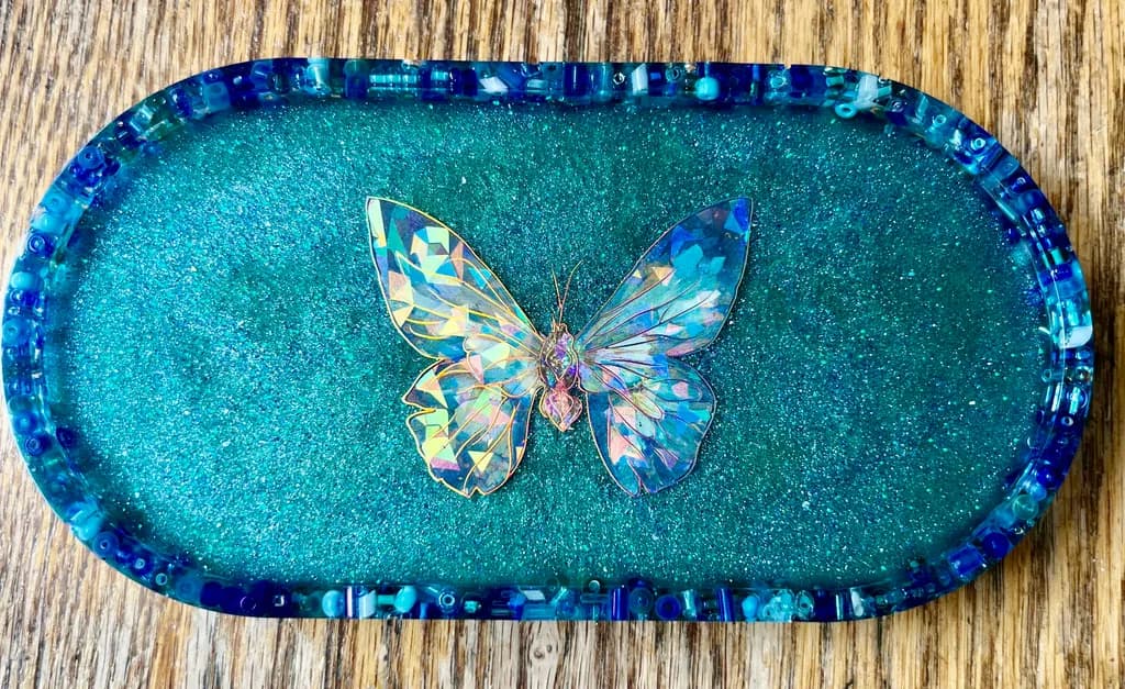 Whimsical Butterfly in Oceanic Blues: A Sparkling Resin Art Piece