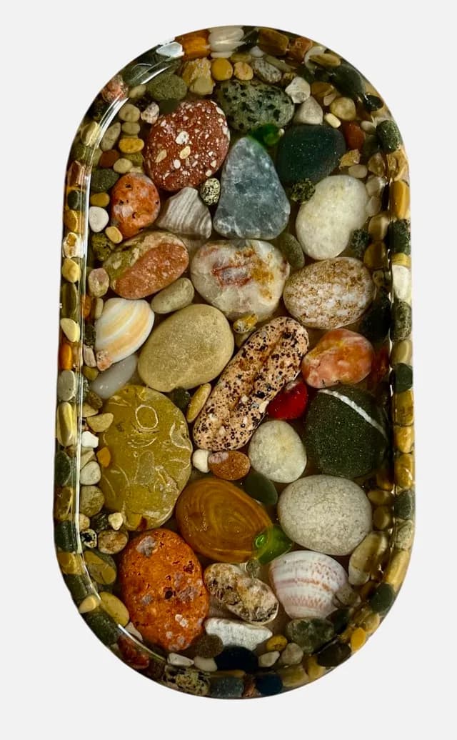 Nature's Mosaic: A Tranquil Collection of River Stones in Resin Artistry