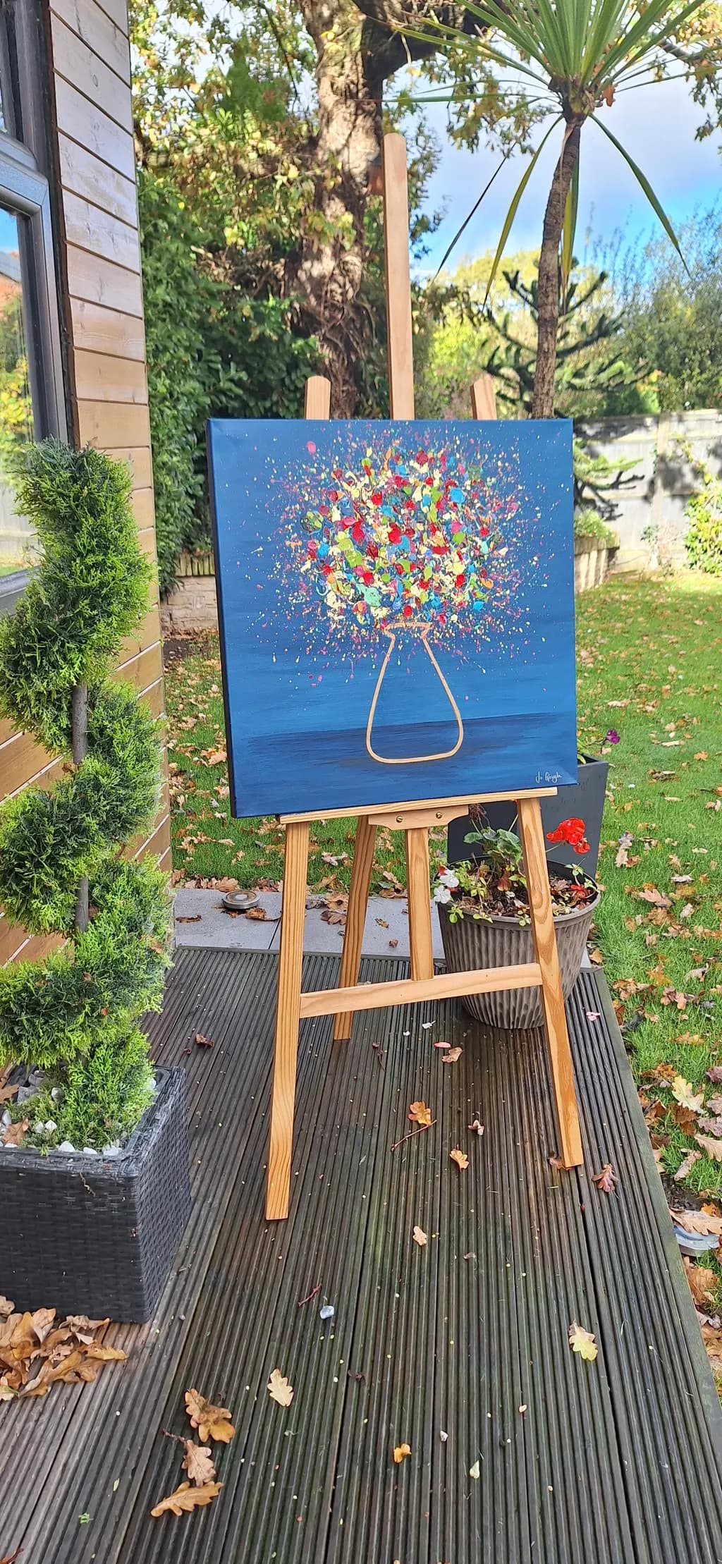 Vibrant Blossoms: A Colorful Explosion in a Glass Vase