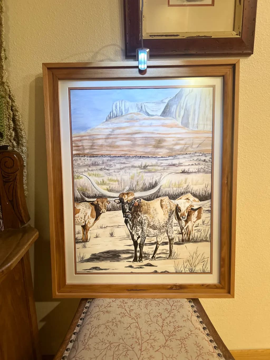 Whispers of the West: A Serene Landscape with Longhorns in the Desert Sun