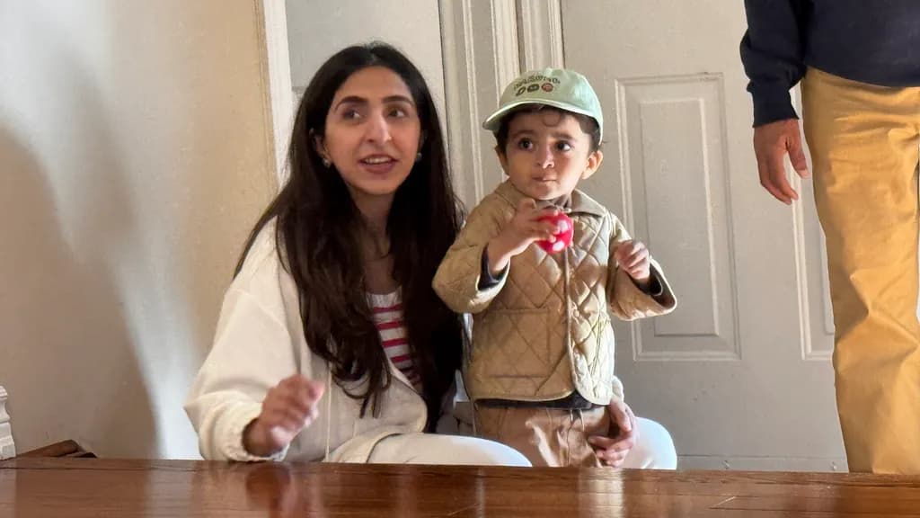 Joyful Moments: A Playful Interaction Between Mother and Child in a Cozy Setting