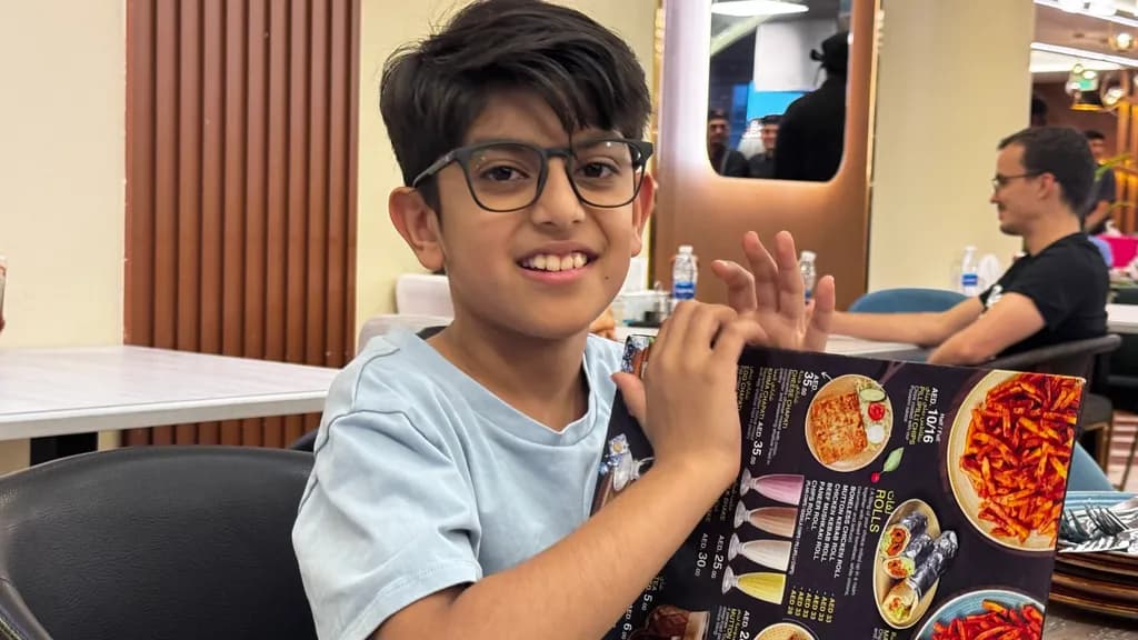 Joyful Moments: A Child's Delight at the Restaurant Menu