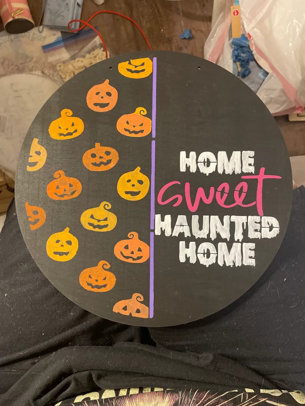 Home Sweet Haunted Home: A Whimsical Halloween Decor Piece with Playful Pumpkins