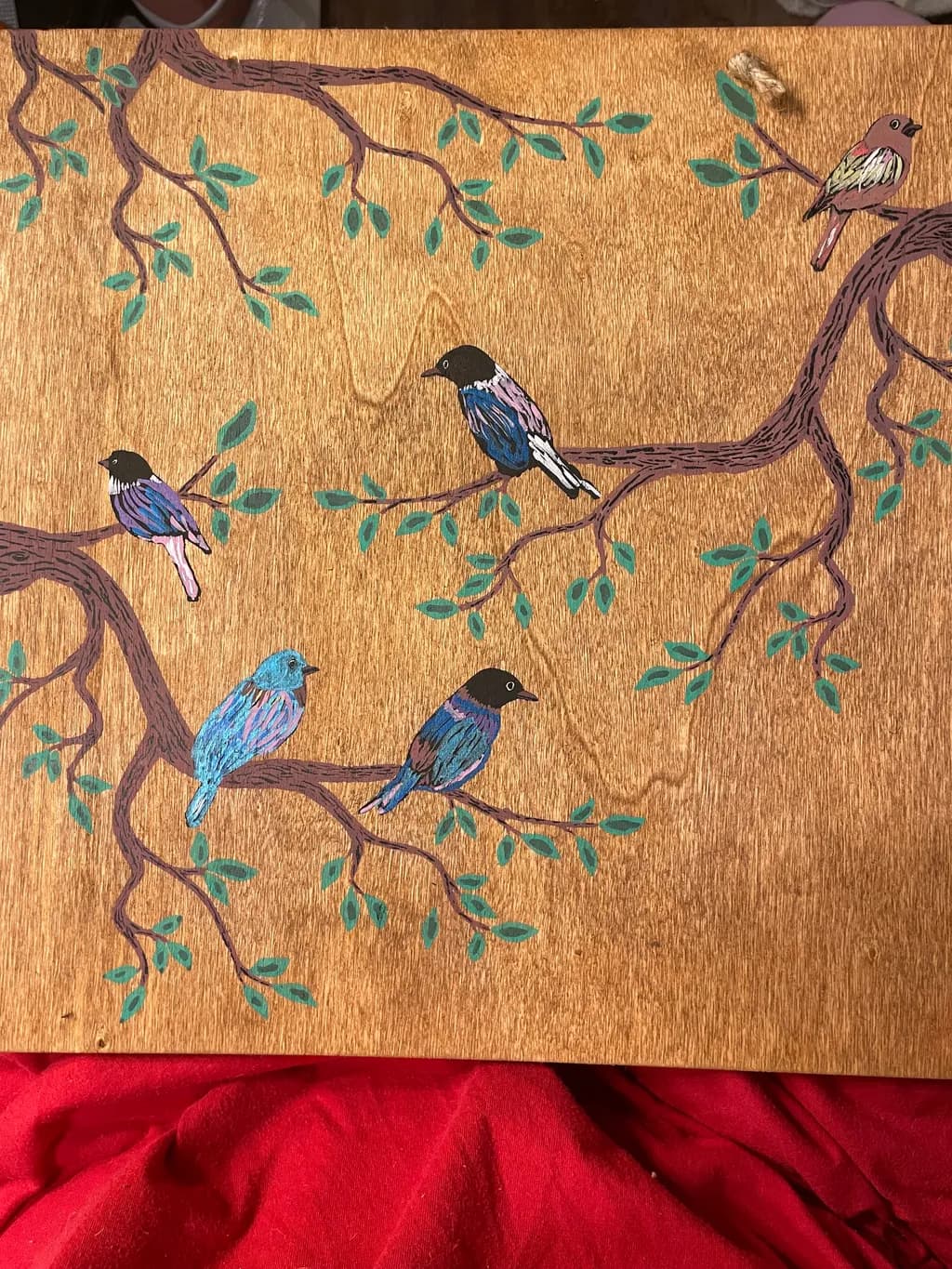 Whimsical Harmony: Colorful Birds Perched on Branches of Nature's Canvas