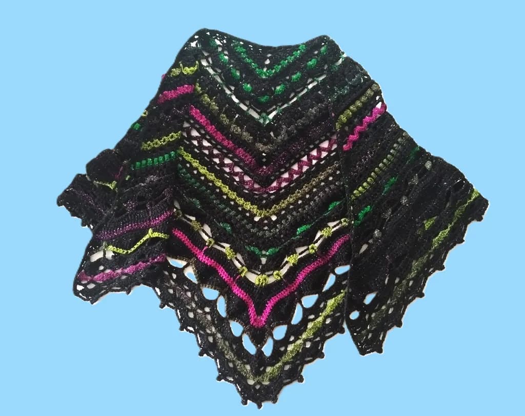 Vibrant Hand-Knit Shawl: A Colorful Accessory with Intricate Patterns