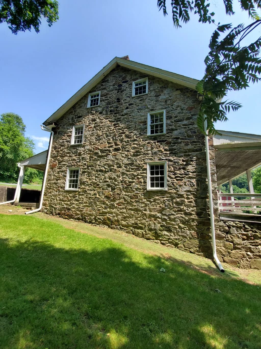 Whispers of History: The Timeless Stone House Beneath the Blue Sky