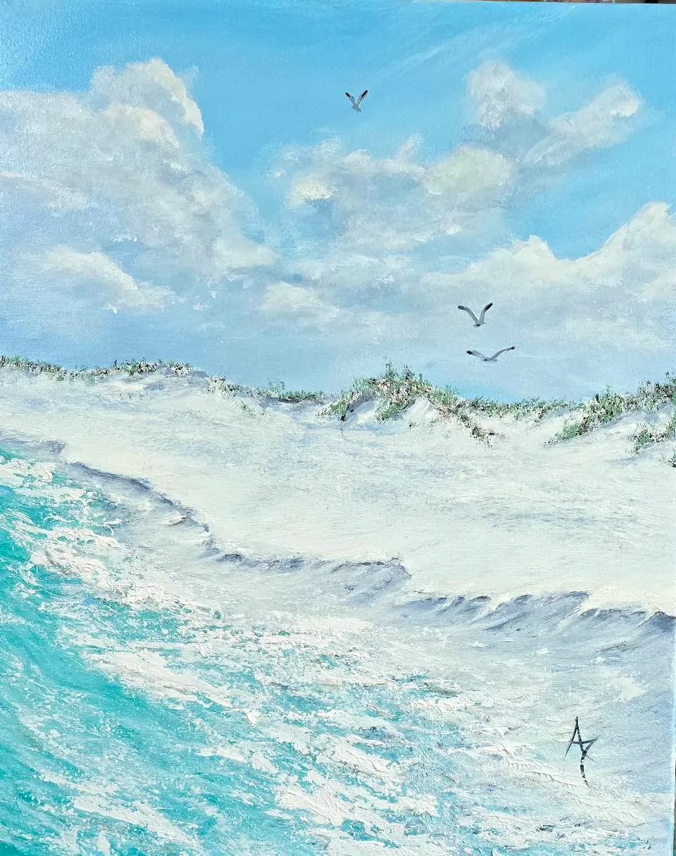 Serenity by the Shore: A Tranquil Beachscape of Waves and Clouds