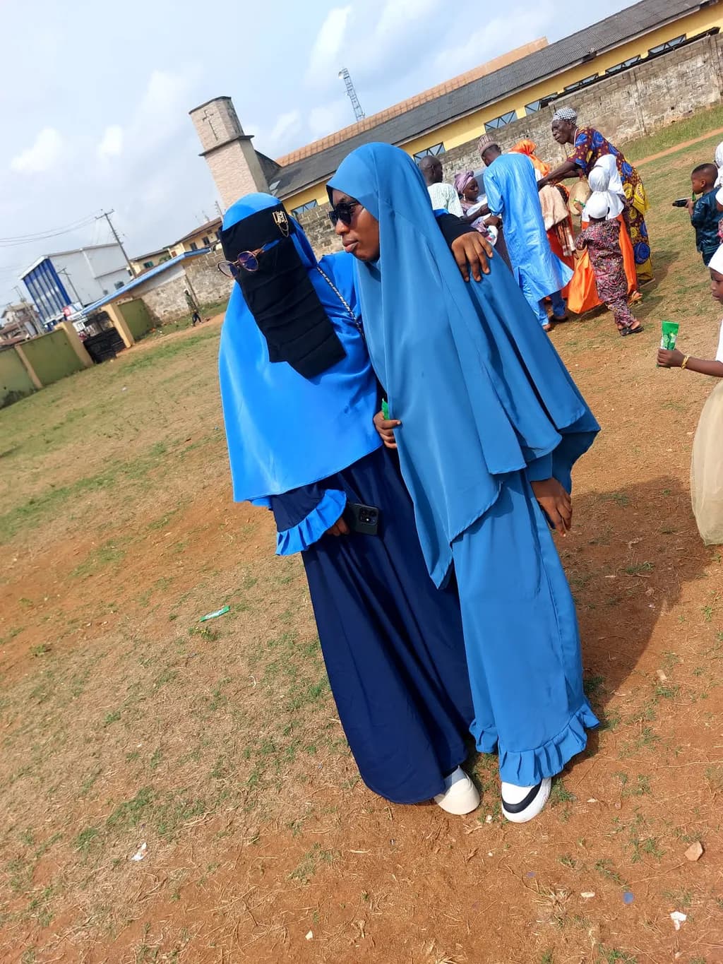 Sisters in Serenity: A Celebration of Culture and Style in Vibrant Blue Attire