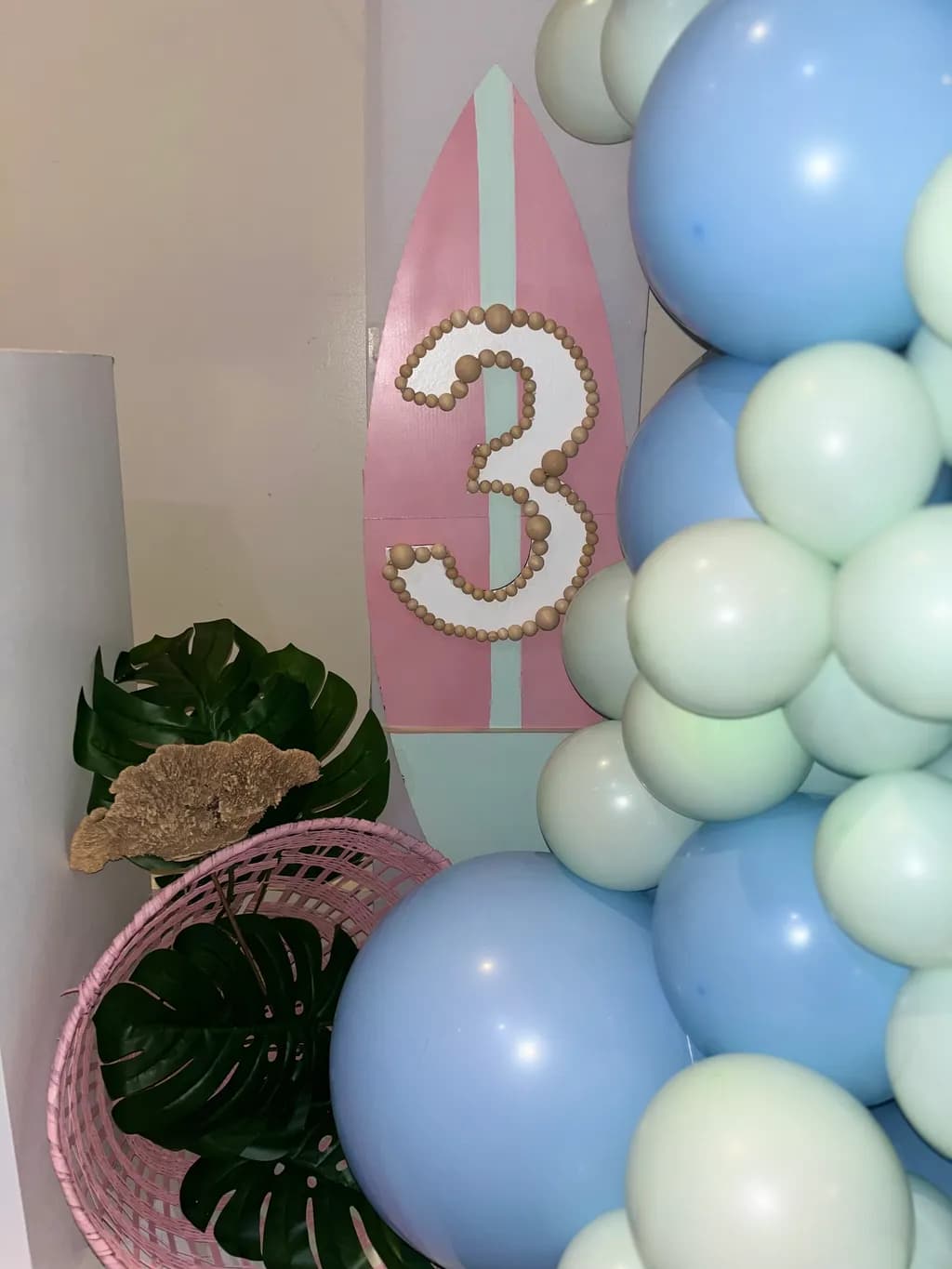 Colorful Beach Celebration: A Whimsical Balloon Party Scene with Tropical Vibes