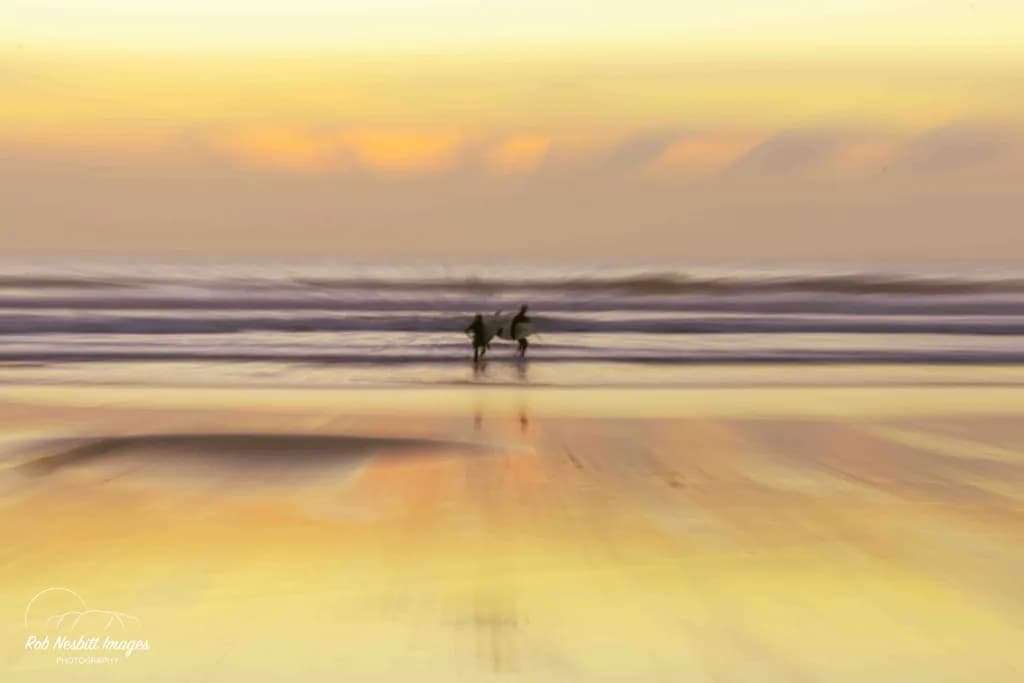 Ethereal Waves: A Serene Sunset Surfing Experience