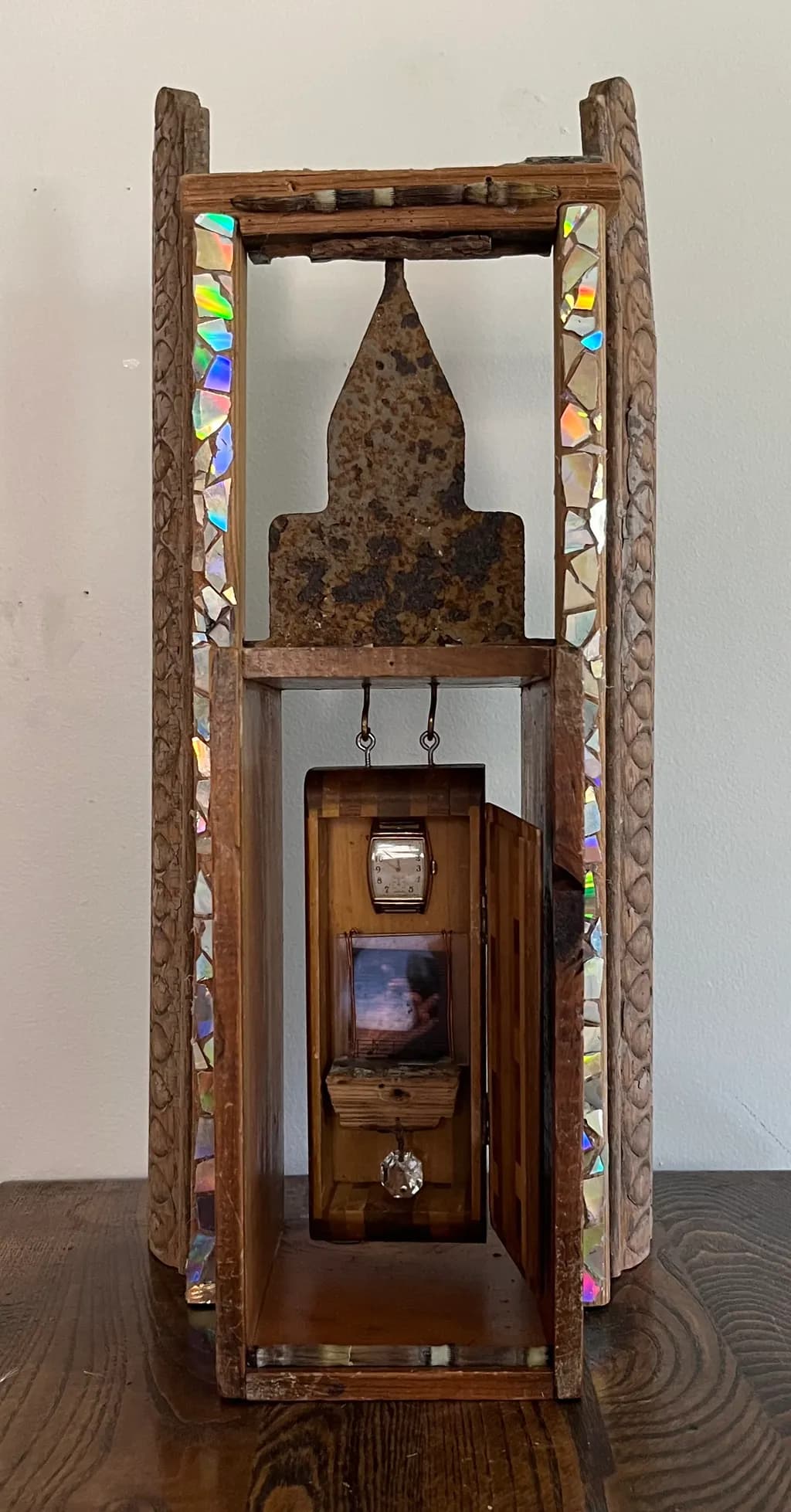 Whispers of Time: An Antique Wooden Treasure Box with Iridescent Accents