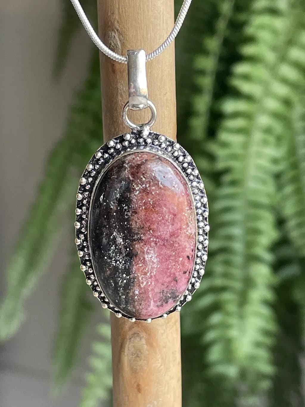 Radiant Rhodonite Pendant: A Harmonious Blend of Nature's Colors in Silver Setting