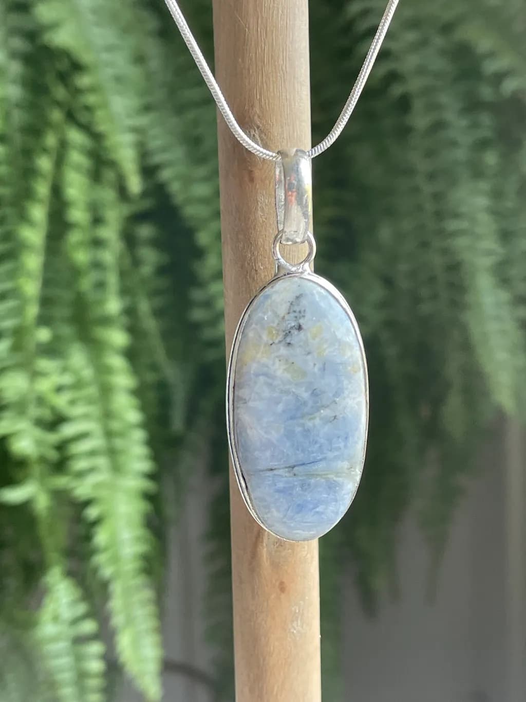 Celestial Serenity: Handcrafted Blue Stone Pendant in Silver Setting