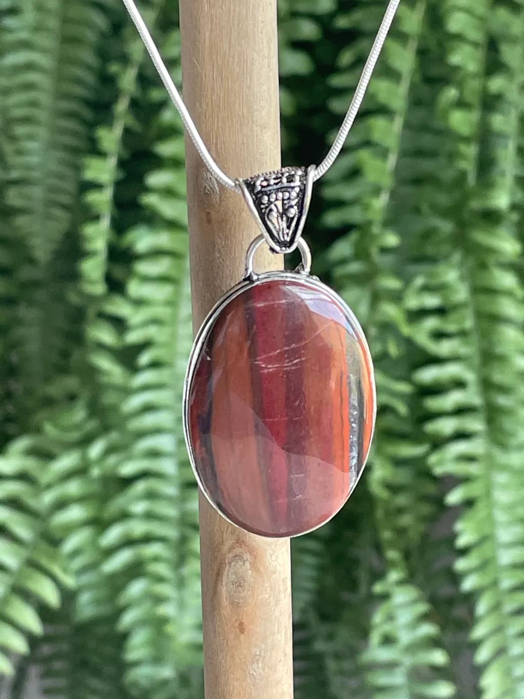 Radiant Earth: Handcrafted Red Jasper Pendant with Silver Accents