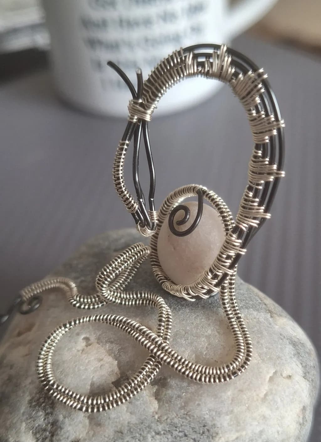 Whimsical Wire Sculpture with Natural Stone Accent: A Unique Artistic Creation