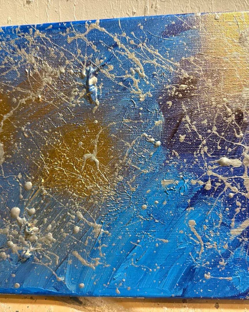 Celestial Splatter: A Dance of Blue and Gold in Abstract Expressionism