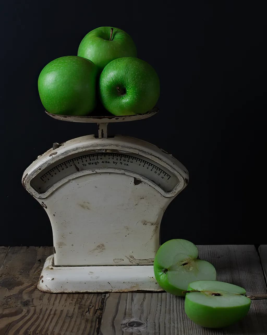 Balancing Nature: A Still Life of Green Apples on a Vintage Scale
