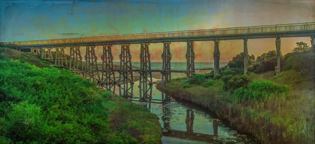 Whispers of the Past: A Serene Sunset Over the Coastal Bridge