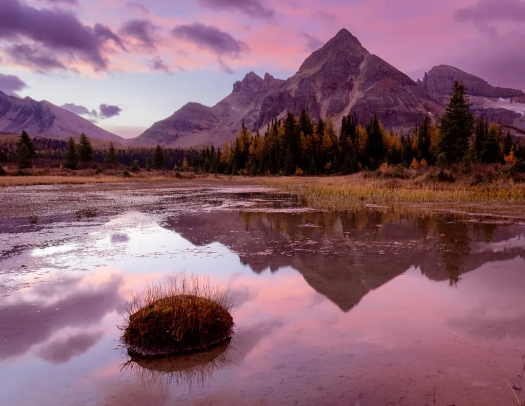 Serenity in Autumn: A Tranquil Reflection of Majestic Mountains