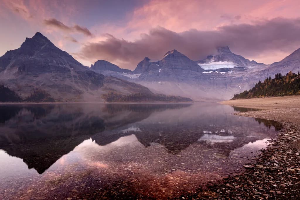Whispers of Dawn: A Serene Reflection of Majestic Mountains