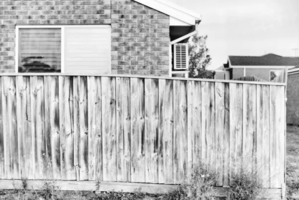 Whispers of Wood: A Monochrome Reflection on Boundaries and Space