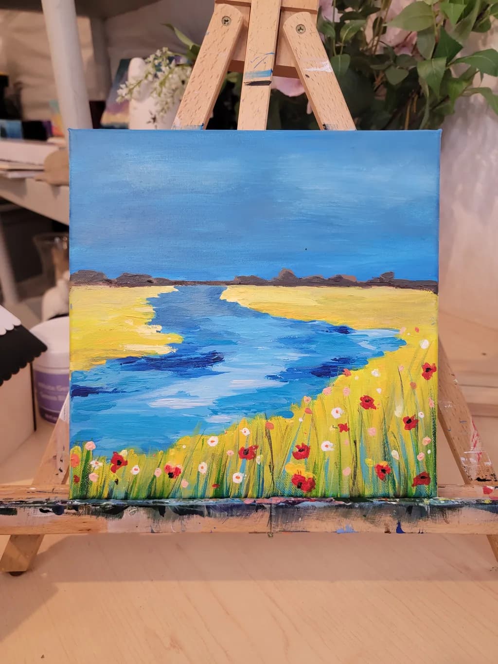 Whispers of Blue: A Serene Landscape of Water and Wildflowers