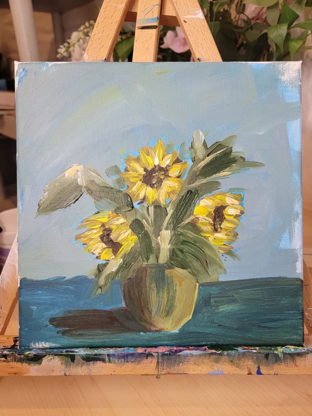 Sunlit Serenity: A Vibrant Bouquet of Sunflowers in a Gentle Embrace of Blue