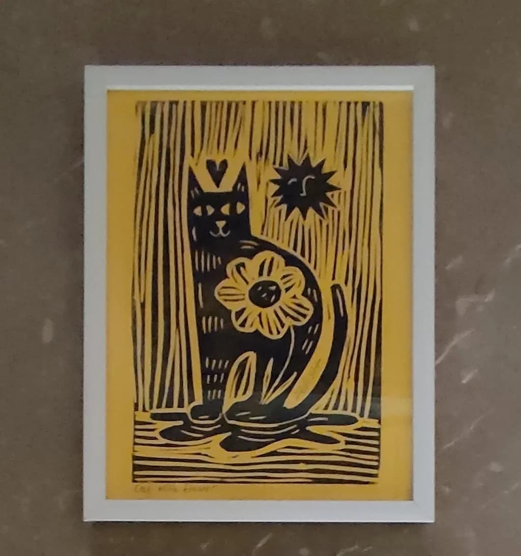 Whimsical Feline: A Playful Cat Amidst Sun and Blooms