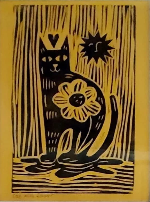 Whimsical Feline: A Playful Cat Embracing Nature's Beauty